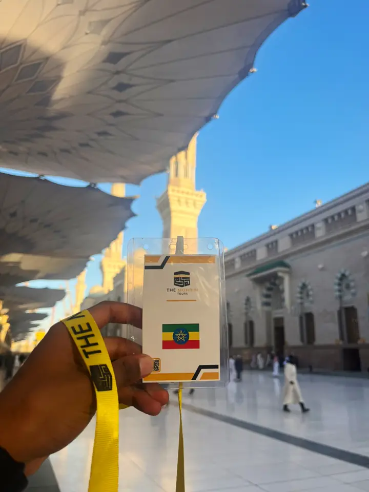 Muhrim Tours ID badge with Ethiopian flag at the Prophet's Mosque in Madinah